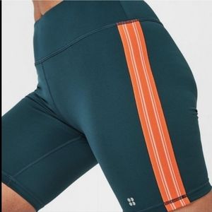Sweaty betty contour biker shorts orange shorts